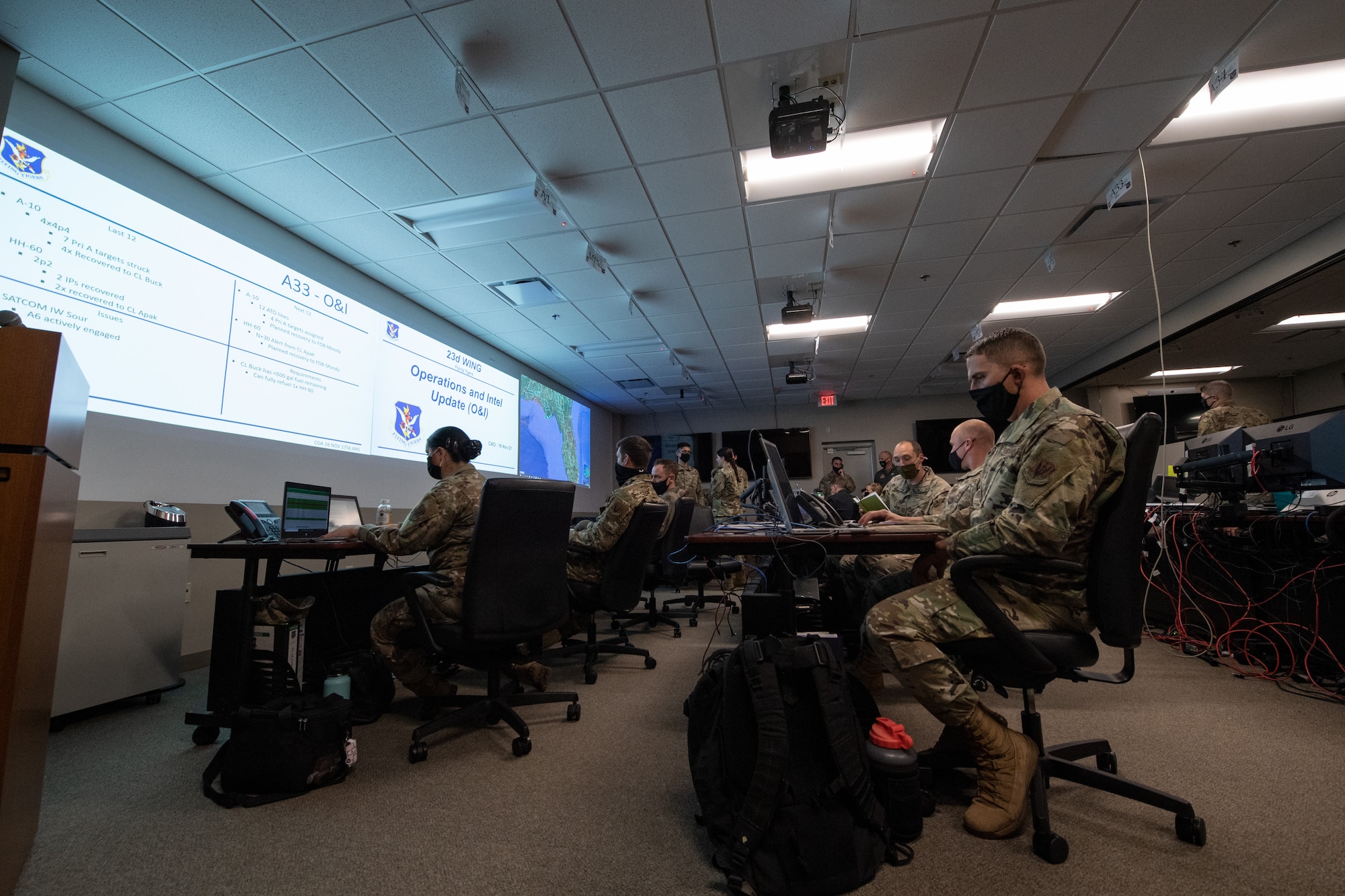 U.S. Air Force Airmen with the 23d Wing A-Staff coordinate unit activities as part of Mosaic Tiger 22-1 Nov. 16, 2021, at Moody Air Force Base, Georgia. The A-Staff is composed of representatives from different core functions throughout the base whose diverse perspectives help synchronize operations and advise the commander. (U.S. Air Force photo by Master Sgt. Daryl Knee)