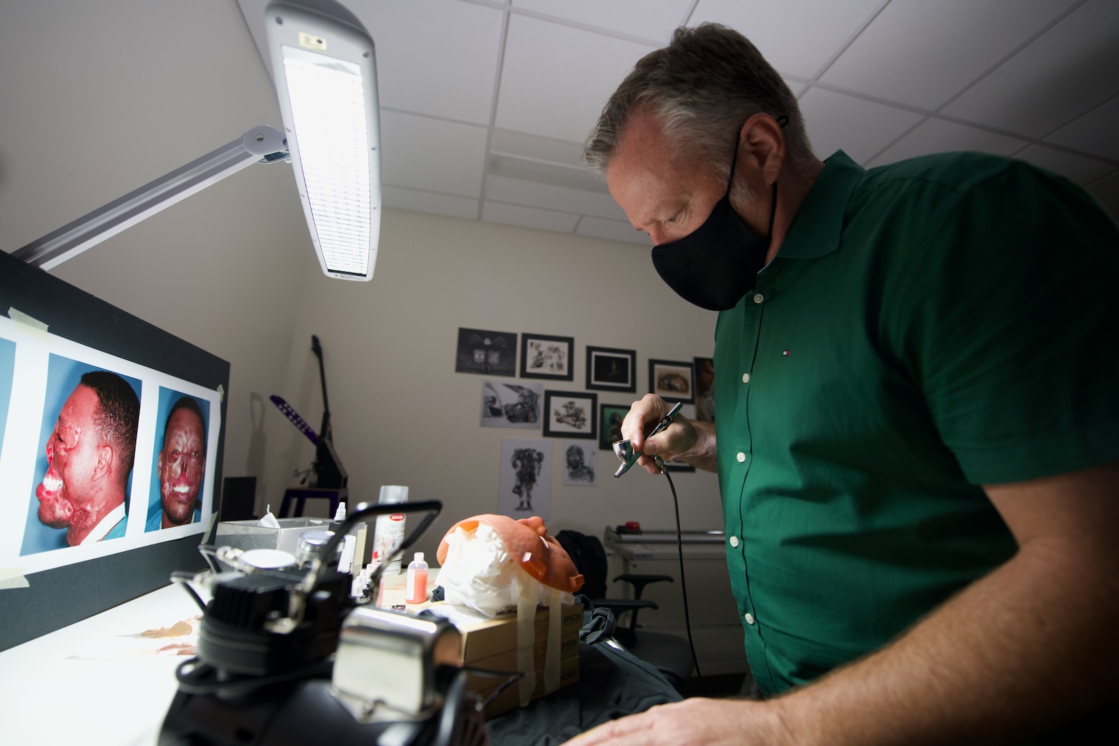 Medical illustrator paints prosthetic mask