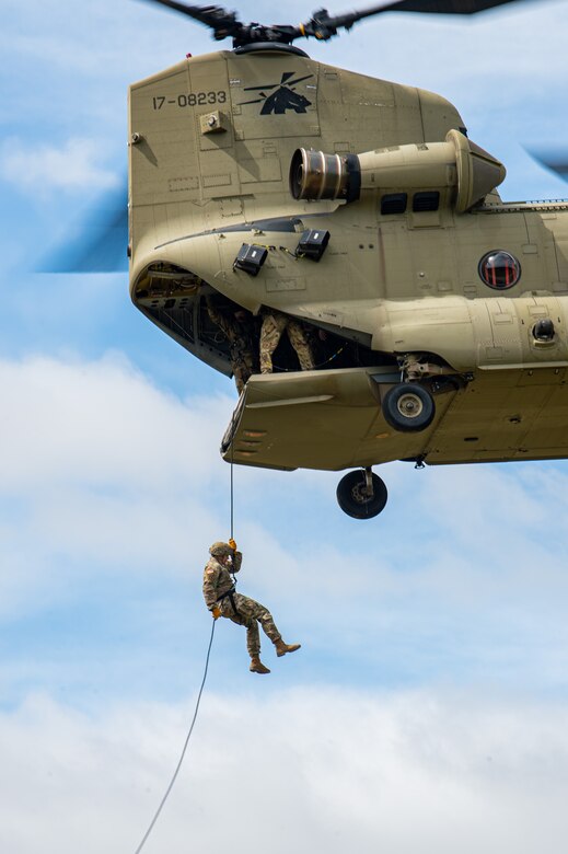 A U.S. Army Soldier from the Security Force Assistance Brigade (SFAB) Team 1231, Joint Task Force Bravo, rappels out of a CH-47 Chinook assigned to the 1st Battalion, 228th Aviation Regiment during an exercise near Soto Cano Air Base, Honduras, Nov. 24, 2021.