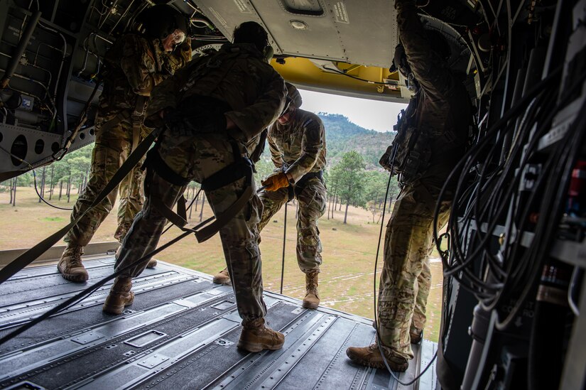 U.S. Army personnel assigned to the Security Force Assistance Brigade (SFAB) Team 1231, Joint Task Force Bravo, conduct rappelling training on a CH-47 Chinook assigned to 1st Battalion, 228th Aviation Regiment, over a training site near Soto Cano Air Base, Honduras, Nov. 24, 2021.