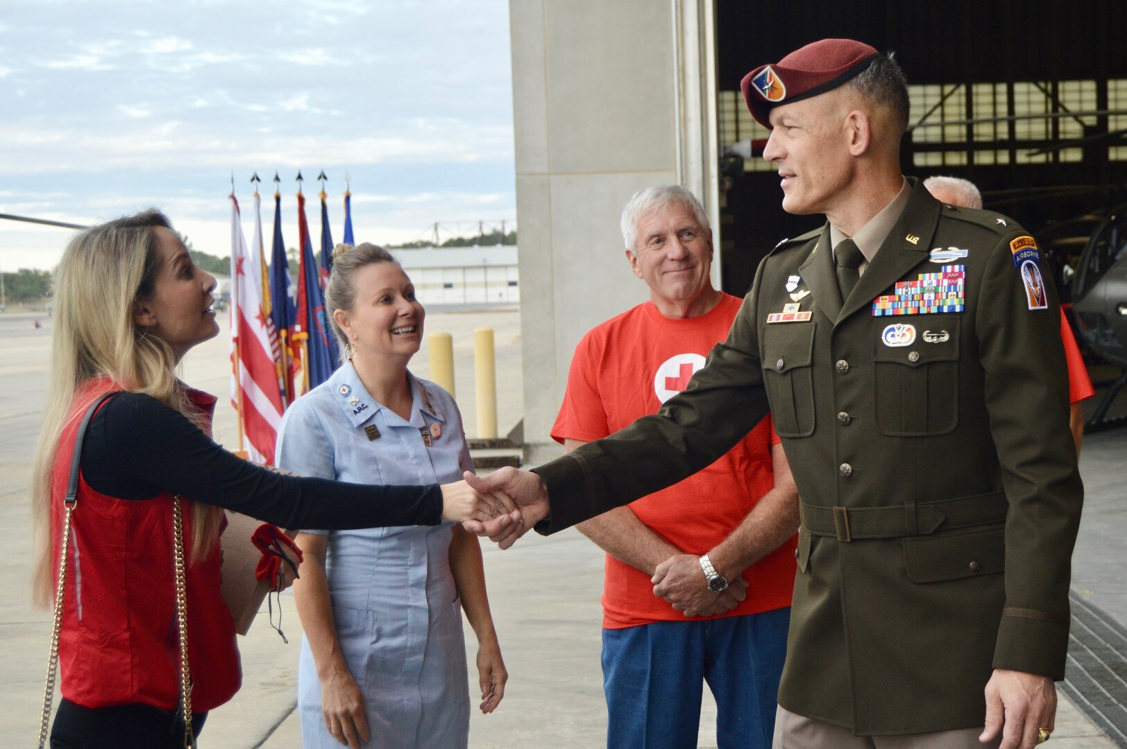 Karen McCoy, executive director, North Louisiana Chapter of the American Red Cross shakes hands with Brig. Gen. David Doyle, commander, Joint Readiness Training Center and Fort Polk.