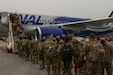 Soldiers with the 1067th Transportation Company, 228th Transportation Battalion, 213th Regional Support Group, Pennsylvania Army National Guard, board an airplane at Harrisburg International Airport early Nov. 30 before departing for their pre-mobilization training in Fort Hood, Texas, ahead of a deployment to the Middle East in support of Operation Spartan Shield. The 272 Soldiers will provide transportation and logistical support to units within Kuwait and the operational area of U.S. Central Command (CENTCOM) during their approximately year-long deployment.