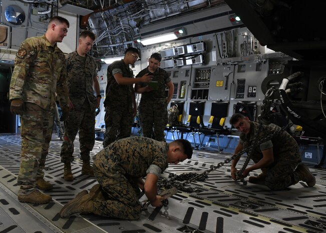 U.S. Marines from the Combat Logistics Company 21 wait for takeoff on a C-17 Globemaster III during a training mission on Marine Corps Air Station Cherry Point, North Carolina, Oct. 26, 2021.