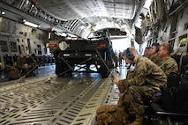U.S. Marines from the Combat Logistics Company 21 wait for takeoff on a C-17 Globemaster III during a training mission on Marine Corps Air Station Cherry Point, North Carolina, Oct. 26, 2021.