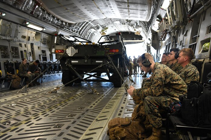 U.S. Marines from the Combat Logistics Company 21 wait for takeoff on a C-17 Globemaster III during a training mission on Marine Corps Air Station Cherry Point, North Carolina, Oct. 26, 2021.