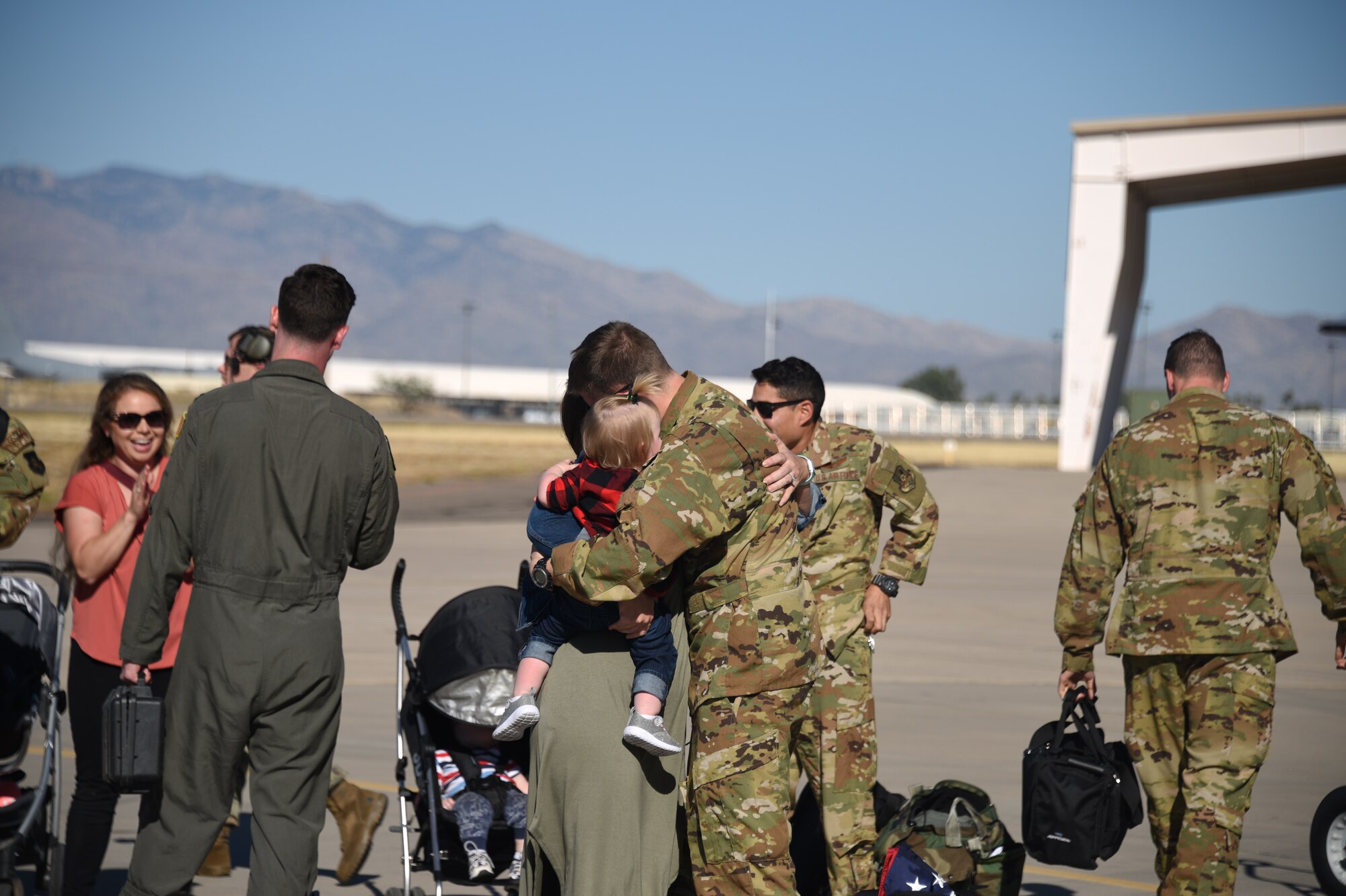 A photo of families reuniting with Airmen.