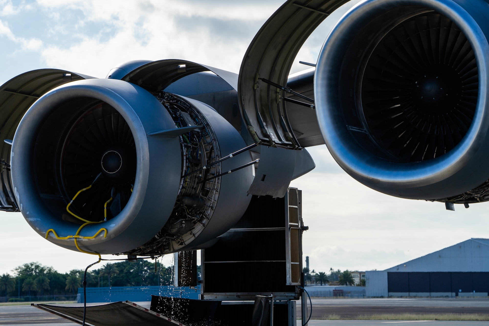 A C-17 Globemaster III receives an eco-wash at Joint Base Pearl Harbor-Hickam, Hawaii, November 18, 2021. C-17’s engines routinely receive this wash to prevent corrosion and to help with fuel efficiency. (U.S. Air Force photo by Airman 1st Class Makensie Cooper)