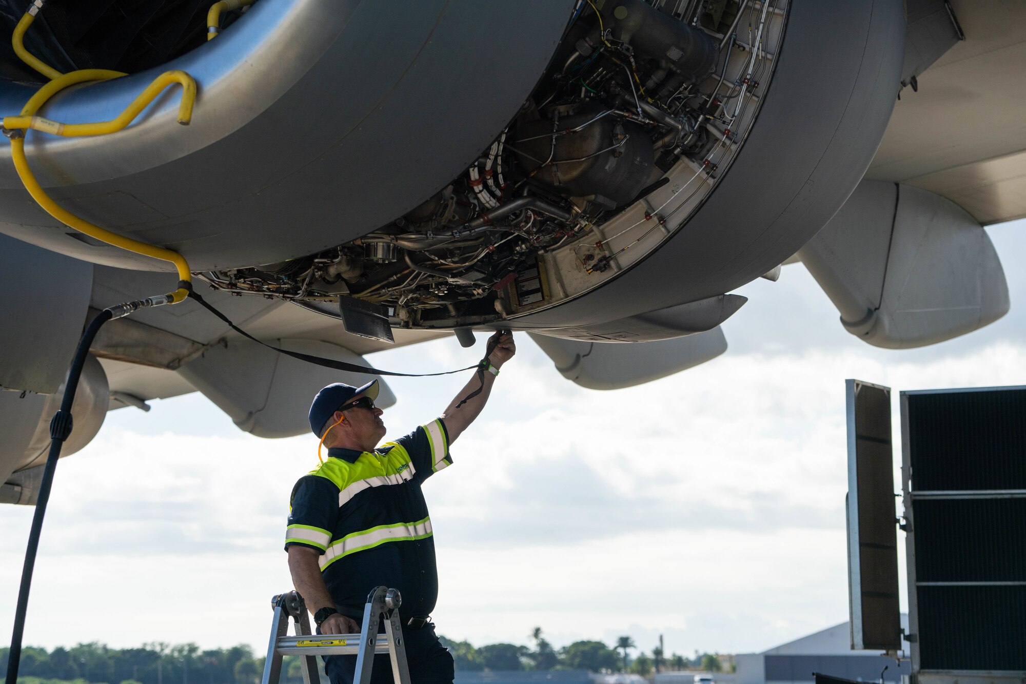 Leroy Moore, a contractor prepares the C-17 Globemaster III’s engines for an eco-wash at Joint Base Pearl Harbor-Hickam, Hawaii, November 18, 2021. C-17’s engines routinely receive this wash to prevent corrosion and to help with fuel efficiency and ensure the engines perform at a high level. (U.S. Air Force photo by Airman 1st Class Makensie Cooper)