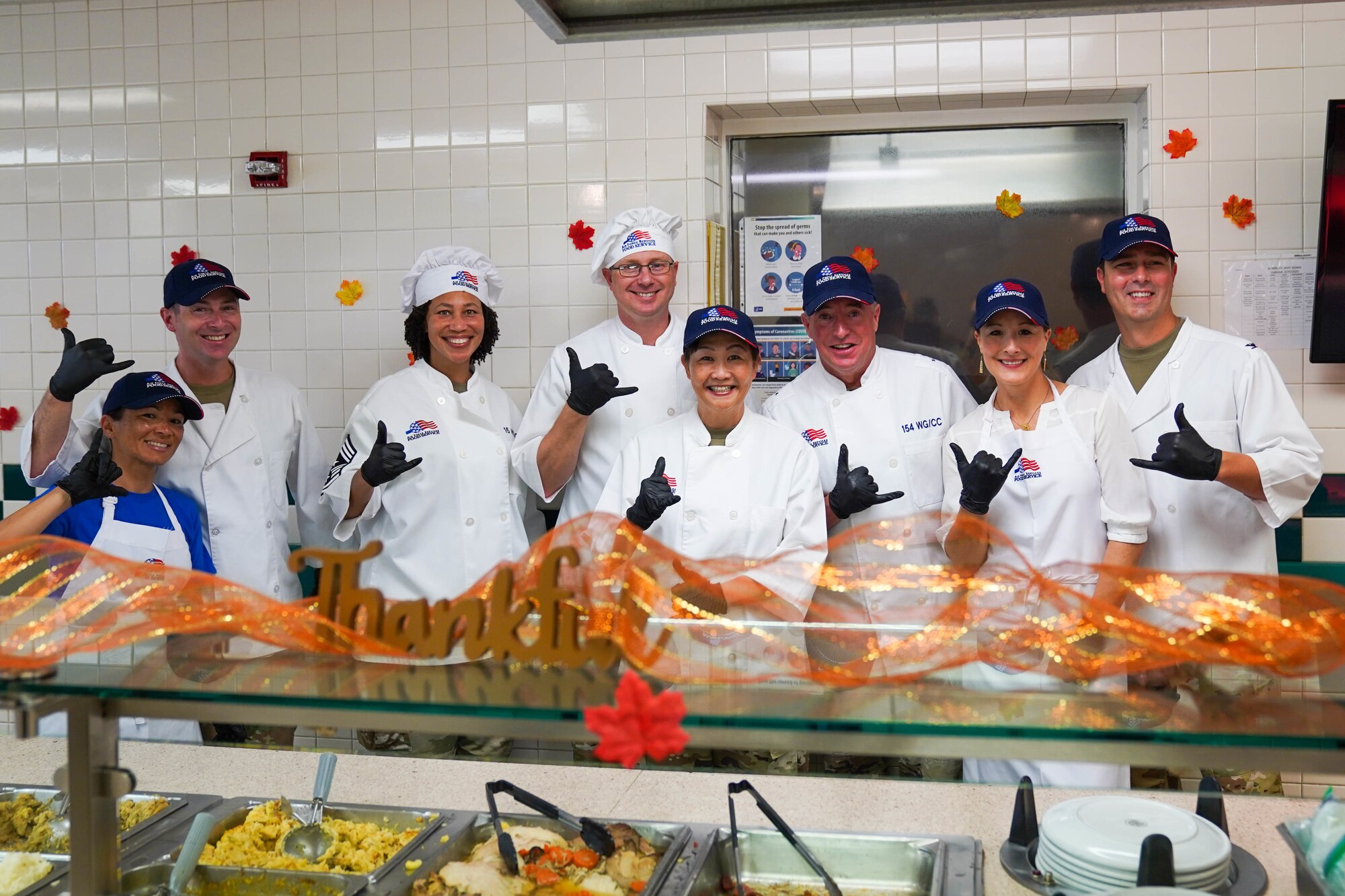 15th Wing Leadership serves airmen Thanksgiving lunch at the Hale Aina Dining Facility, November 25, 2021.  Leaders from Joint Base Pearl Harbor-Hickam served airmen and their families lunch on Thanksgiving. (U.S. Air Force photo by Airman 1st Class Makensie Cooper)