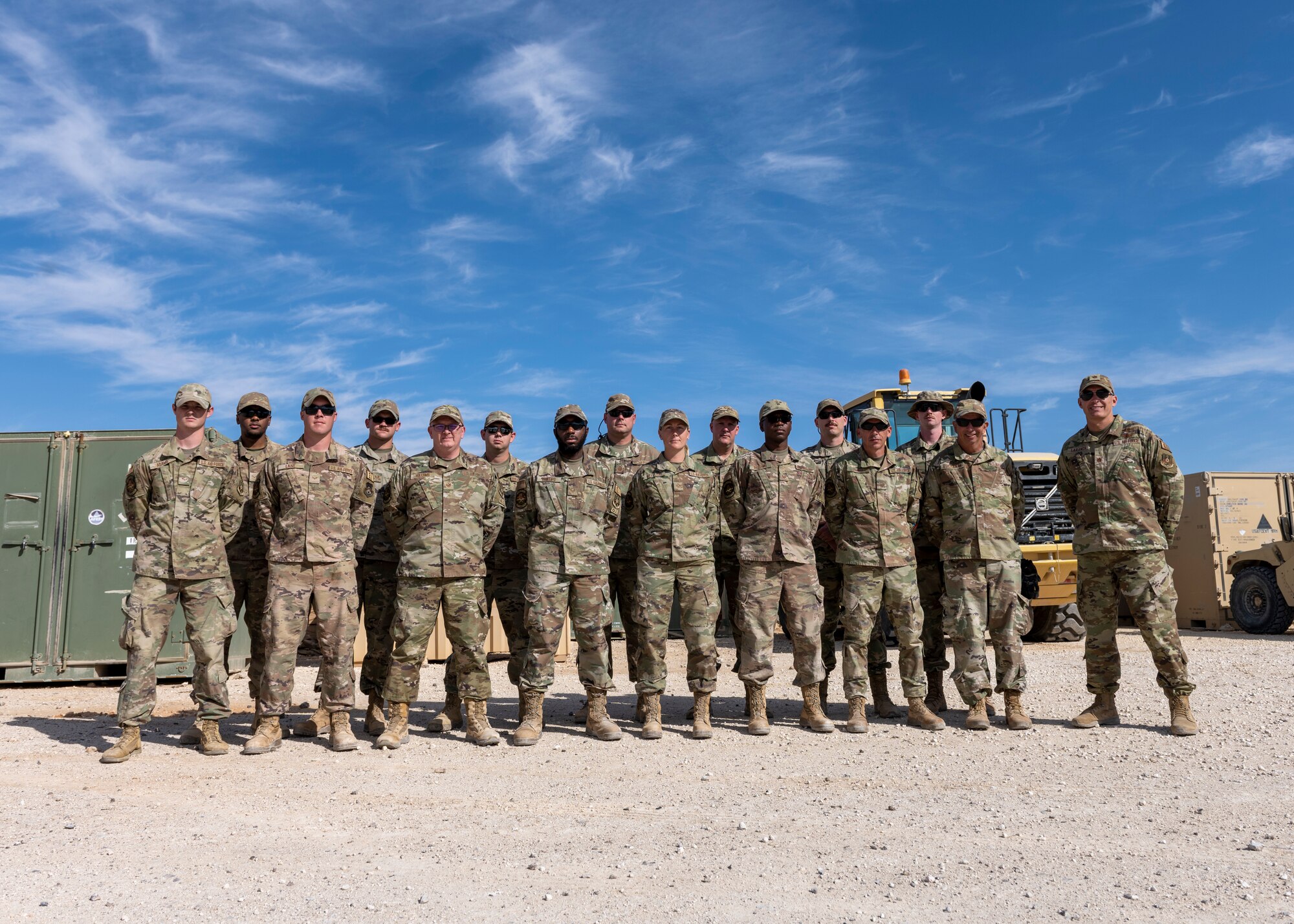 The 332nd Expeditionary Communications Squadron engineering and installation team stands for a photo