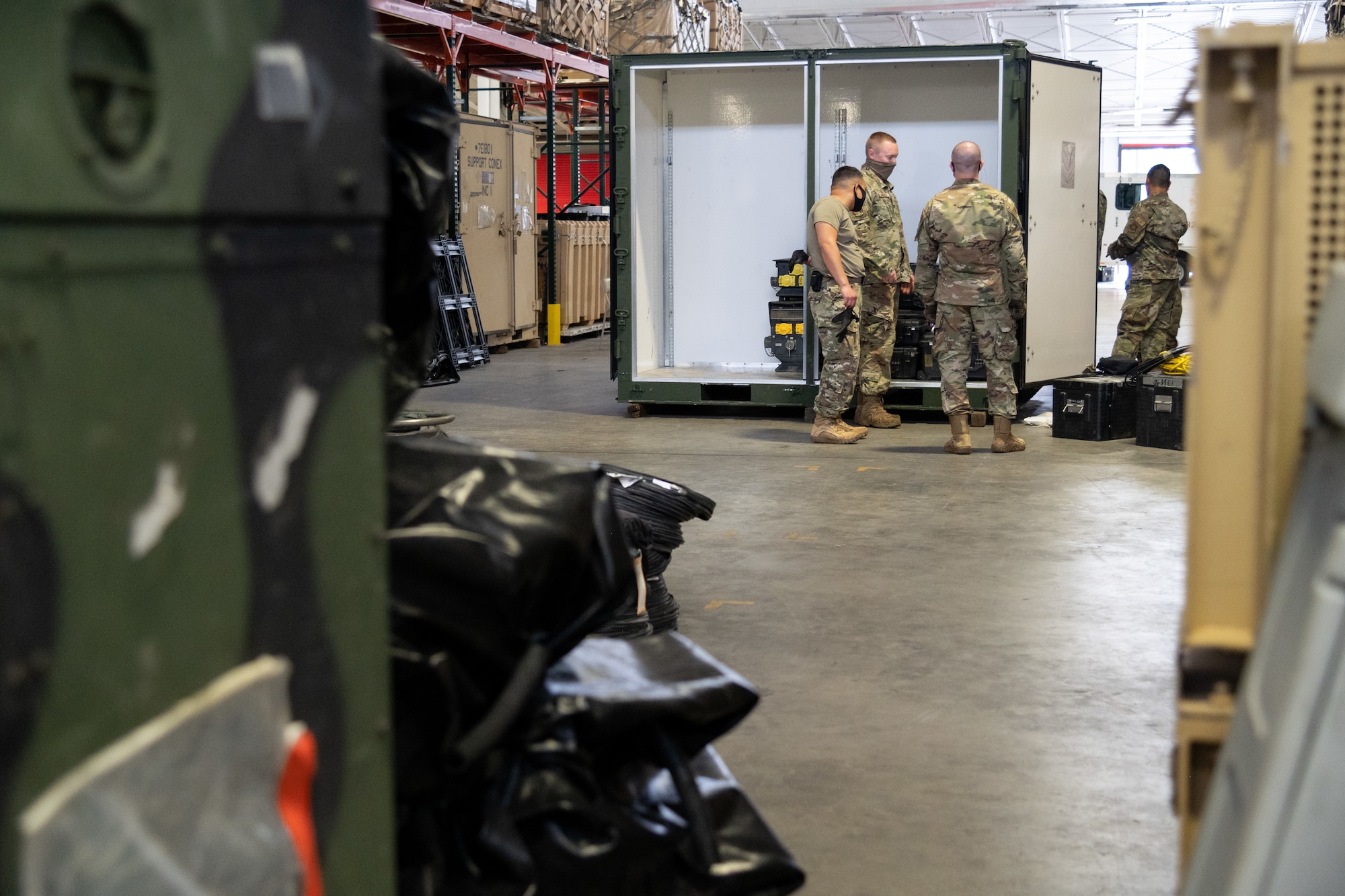 U.S. Airmen assigned to the 621st Contingency Response Wing pack equipment into a storage container Oct. 8, 2021, at Joint Base McGuire-Dix-Lakehurst, New Jersey. The 621st CRW is accelerating change by adding another CR squadron to the 821st CRG at Travis Air Force Base, California, and the 621st CRG at JBMDL. (U.S. Air Force photo by Staff Sgt. Sarah Brice