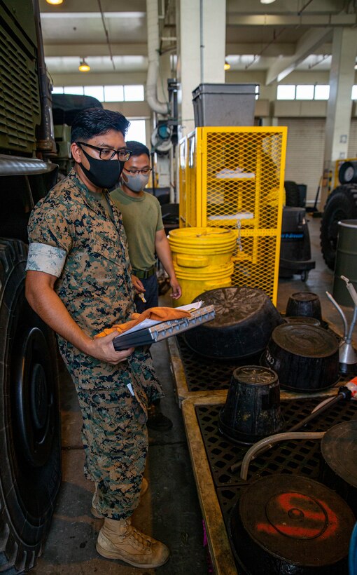 U.S. Marine Corps Cpl. Rendy Catete, the training noncommissioned officer in charge with the Environmental Support Team, Headquarters and Support Battalion, Marine Corps Installations Pacific, conducts an environmental safety audit on Camp Foster, Okinawa, Japan, Sep. 28, 2021. Catete was originally born in the U.S. and moved to Monterrey, Mexico, with his family where he lived for the first three years of his life. His parents, seeking better paying jobs and higher education for their four children, immigrated to Dallas, Texas, and began their family’s journey to citizenship. (U.S. Marine Corps photo by Lance Cpl. Alex Fairchild)