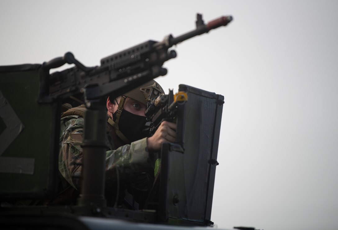 Airman Hayden Craig, 8th Security Forces Squadron entry controller, searches for opposing forces during a routine training event at Kunsan Air Base, Republic of Korea, Oct. 1, 2021. Security forces undergo constant training to ensure they are always ready to fight tonight. (U.S. Air Force photo by Senior Airman Suzie Plotnikov)