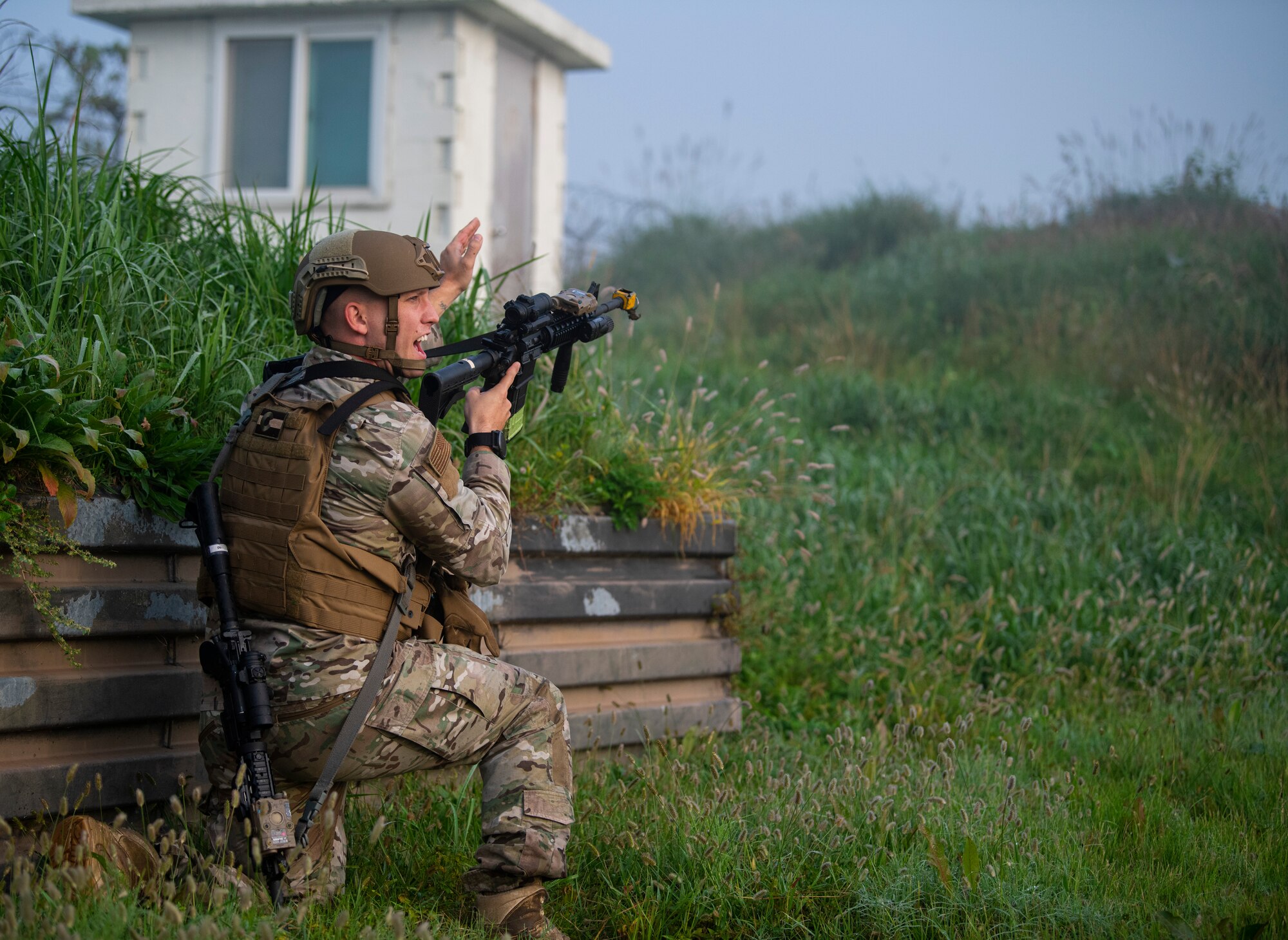Staff Sgt. Ryan Daggett, 8th Security Forces Squadron patrolman, shouts commands to other defenders during a routine training event at Kunsan Air Base, Republic of Korea, Oct. 1, 2021. Security forces undergo constant training to ensure they are always ready to fight tonight. (U.S. Air Force photo by Senior Airman Suzie Plotnikov)
