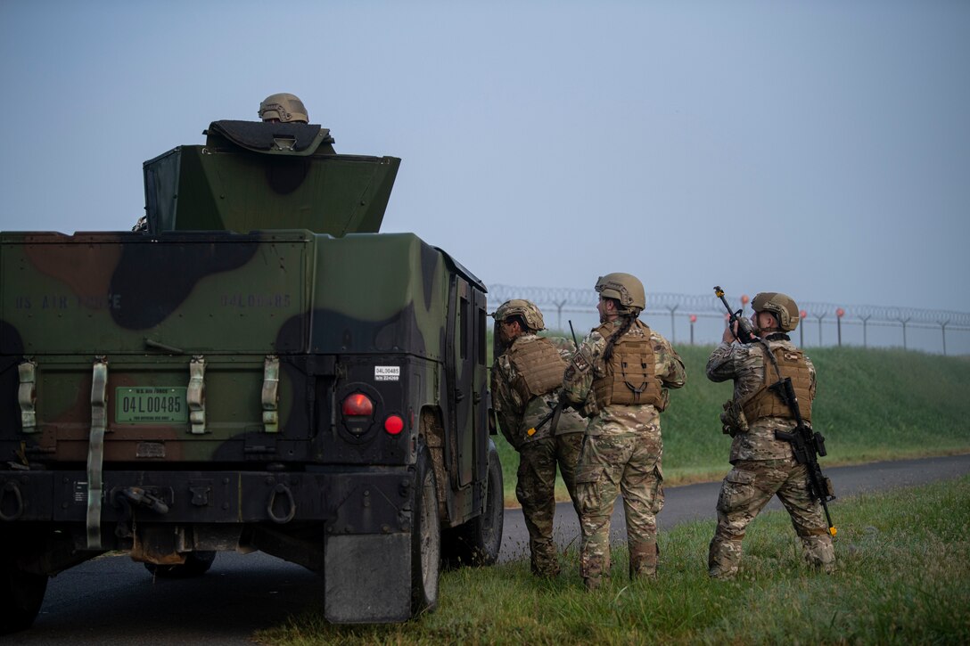 Defenders from the 8th Security Forces Squadron search for opposing forces during a routine training event at Kunsan Air Base, Republic of Korea, Oct. 1, 2021. Security forces undergo constant training to ensure they are always ready to fight tonight. (U.S. Air Force photo by Senior Airman Suzie Plotnikov)