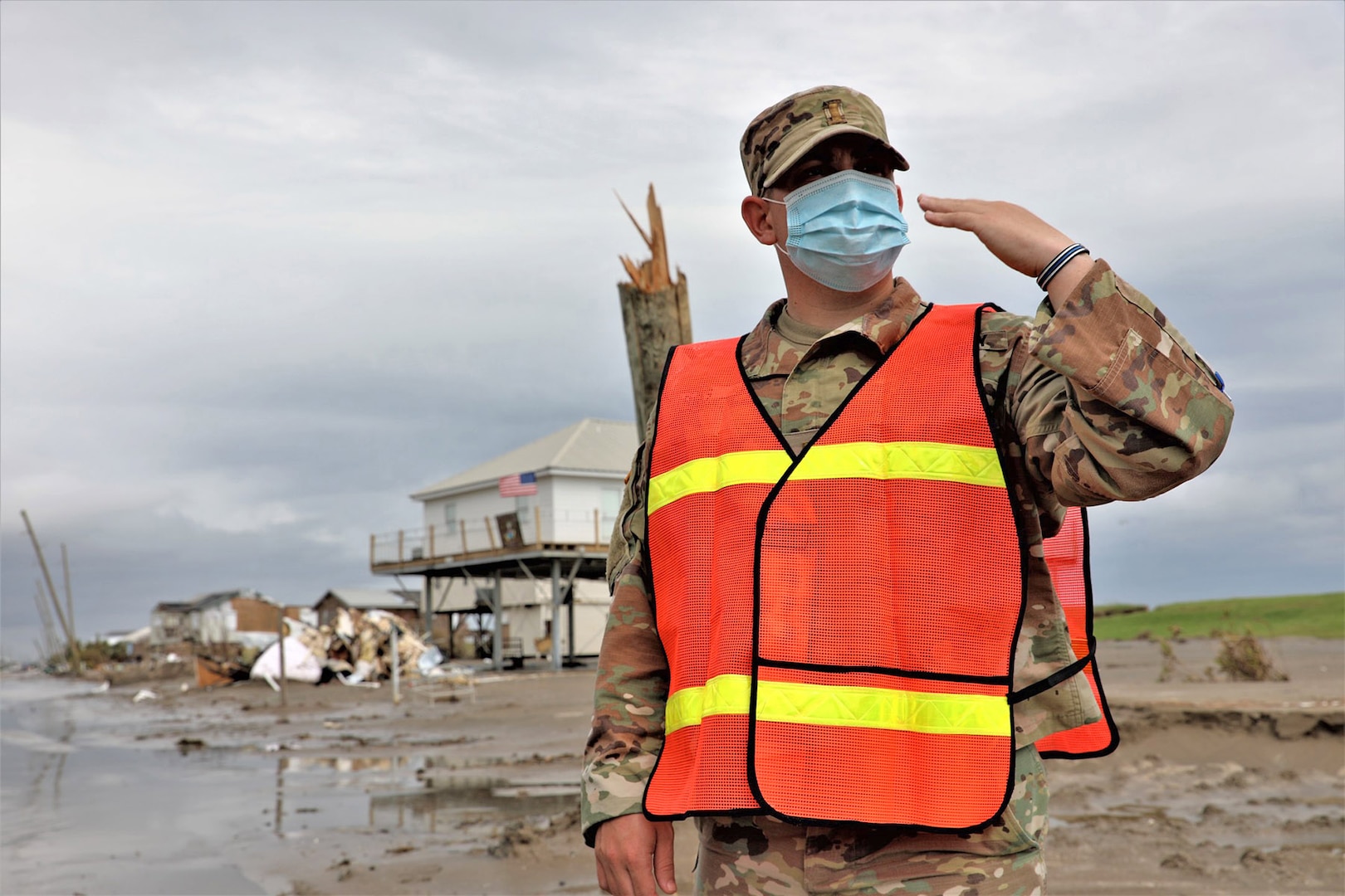 Mississippi National Guard 2nd Lt. Austin Riels, assigned to the 113th Military Police Company, 112th Military Police Battalion, waves vehicles through a traffic control point after Hurricane Ida, Grand Isle, Louisiana, Sept. 17, 2021.