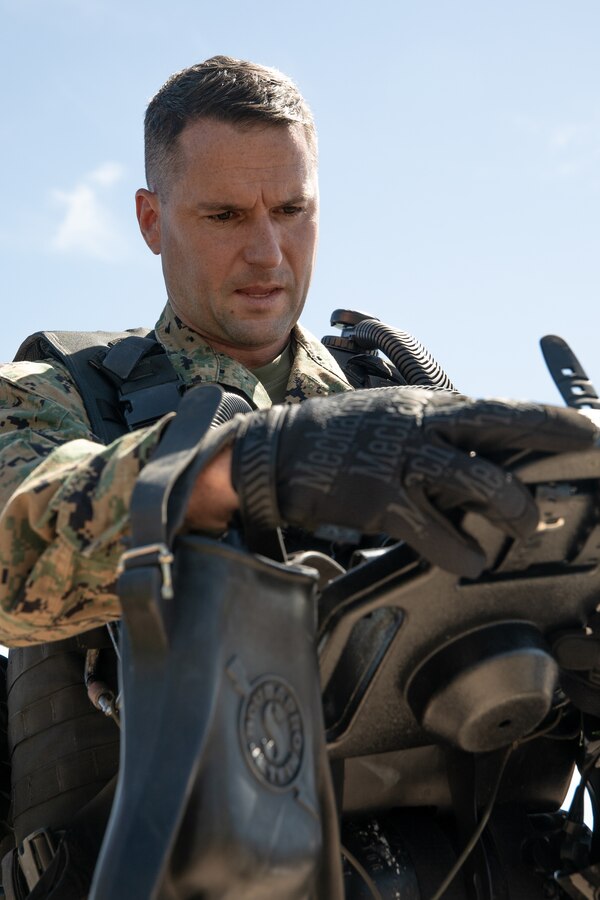 U.S. Marine Corps Lt. Col. Thomas Waller, commanding officer of 3d Force Reconnaissance Company, 4th Marine Division, Marine Forces Reserve, calibrates a depth gauge prior to conducting dive training in Mobile, Alabama, Sept. 25, 2021. Dive training enables the Marines with 3d Force Reconnaissance Co. to maintain and improve their diving skills as well as building confidence in themselves and their gear. (U.S. Marine Corps photo by Cpl. Brendan Mullin)