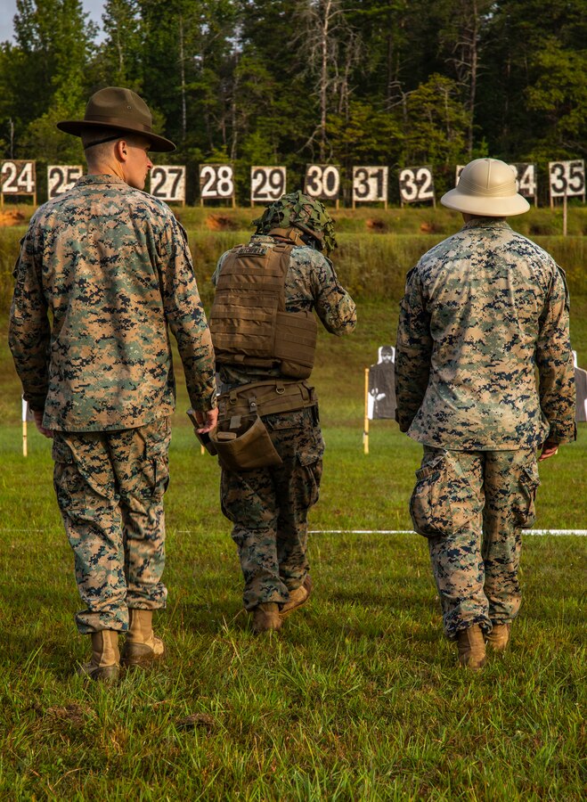 Marines with Combat Marksmanship Coaches Reserve (CMCR) engage targets on the move while conducting the new Annual Rifle Qualification (ARQ) at Marine Corps Base Quantico, Virginia, Sept. 21, 2021. The CMCR students are the first to qualify as Combat Marksmanship Coaches under the new ARQ that will soon be implemented across the Marine Corps. Marine Forces Reserve Marines will begin to qualify under the new ARQ in Fiscal Year 22 as the Marine Corps continues to adapt training to increase lethality throughout the Marine Corps, regardless of their Military Occupational Specialty. (U.S. Marine Corps photos by Lance Cpl. Samwel Tabancay)