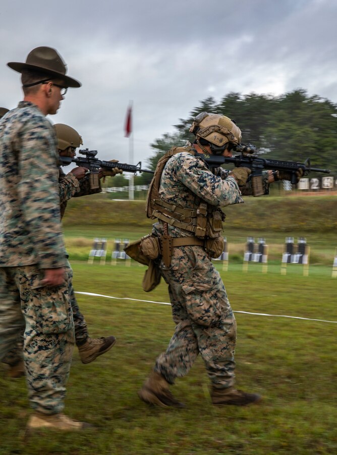 Marines with Combat Marksmanship Coaches Reserve (CMCR) engage targets on the move while conducting the new Annual Rifle Qualification (ARQ) at Marine Corps Base Quantico, Virginia, Sept. 21, 2021. The CMCR students are the first to qualify as Combat Marksmanship Coaches under the new ARQ that will soon be implemented across the Marine Corps. Marine Forces Reserve Marines will begin to qualify under the new ARQ in Fiscal Year 22 as the Marine Corps continues to adapt training to increase lethality throughout the Marine Corps, regardless of their Military Occupational Specialty. (U.S. Marine Corps photos by Lance Cpl. Samwel Tabancay)