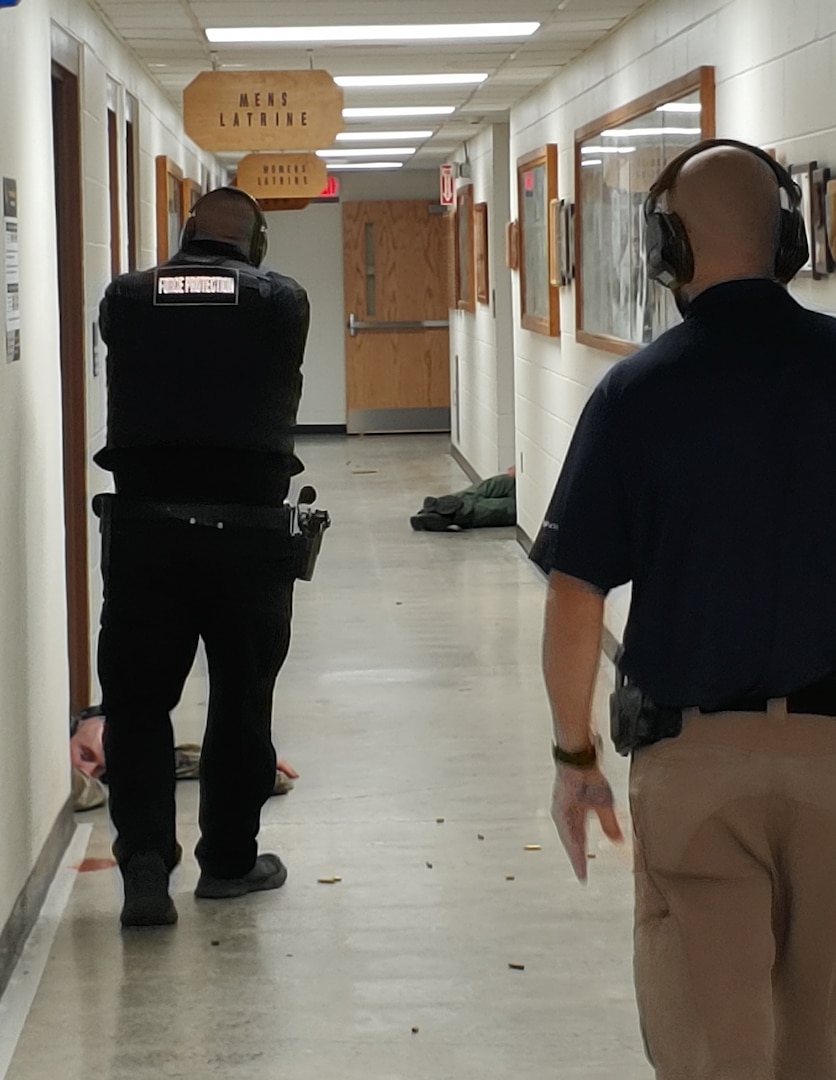 Vermont National Guard state force protection officers, mentored by Burlington Police Department patrol instructors respond to a simulated active shooter situation on September 26 at the Mountain Warfare School in Jericho, VT.  The event marked the first time state force protection officers from the Army and Air Guard trained together in active shooter response. (U.S. Army National Guard photo by Joshua T. Cohen)