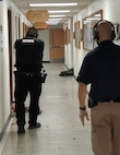 Vermont National Guard state force protection officers, mentored by Burlington Police Department patrol instructors respond to a simulated active shooter situation on September 26 at the Mountain Warfare School in Jericho, VT.  The event marked the first time state force protection officers from the Army and Air Guard trained together in active shooter response. (U.S. Army National Guard photo by Joshua T. Cohen)