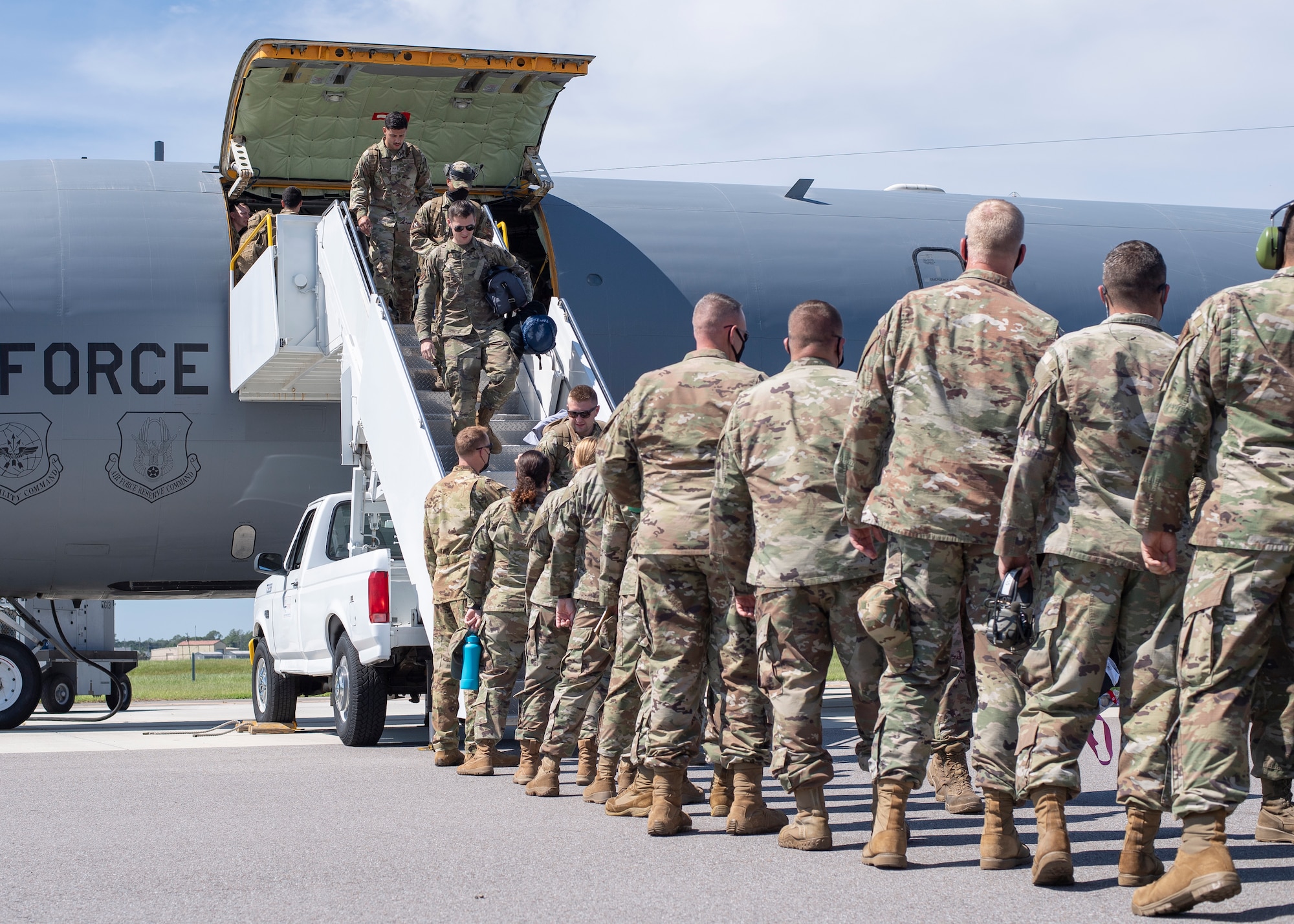 Airmen from the 6th Maintenance Group are greeted by their wingmen after returning from deployment at MacDill Air Force Base, Florida, Sept. 27, 2021.