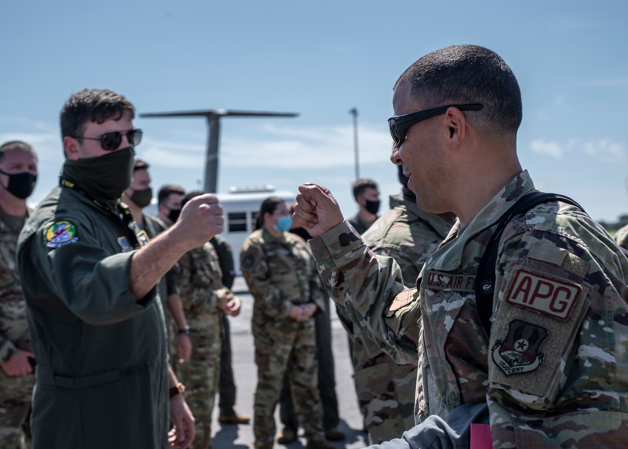 An Airman fist-bumps a wingman after returning home from deployment at MacDill Air Force Base, Florida, Sept. 27. 2021.