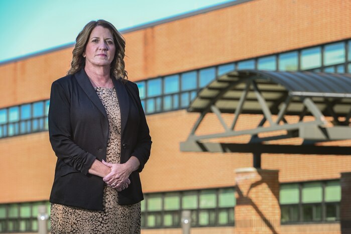 Dorothy Febbi, Operational Contracting Division chief, stands outside her work center at Hanscom Air Force Base, Mass., Sept. 28. Febbi will retire in October following a 35-year career of civil service. (U.S. Air Force photo by Todd Maki)