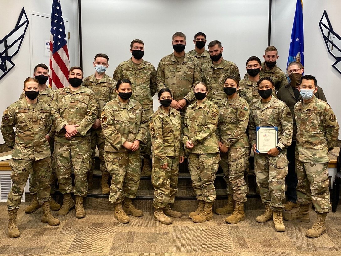 Some members of the Airman Leadership School graduating class 21-H standing together at the Hill Professional Development Center