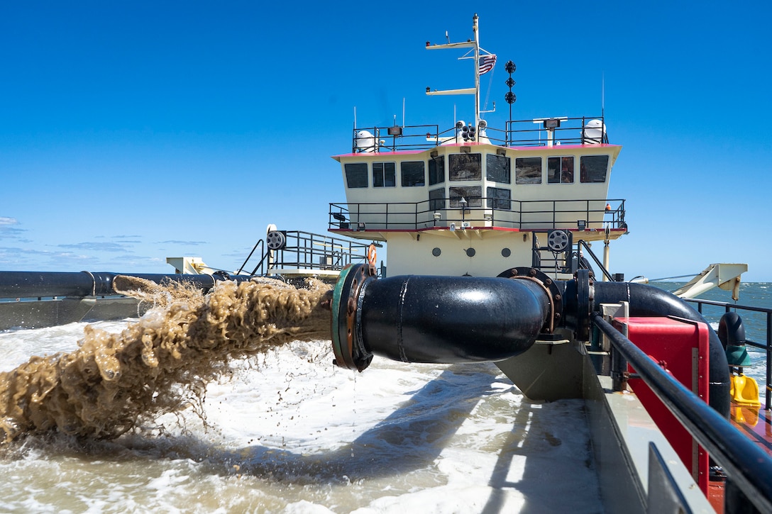 U.S. Army Corps of Engineers, Wilmington District’s, Hopper Dredge MURDEN pumps slurry prior to beach replenishment efforts during 24/7 dredge operations in an inlet near Ocean City, Md., Sept. 20, 2021.  Ocean City beaches are routinely replenished every four years with periodic emergency projects as needed following storms and other natural events. Beach replenishment in the area has prevented nearly $920 million in damages since its completion in the 1990s. (U.S. Army photo by Greg Nash)