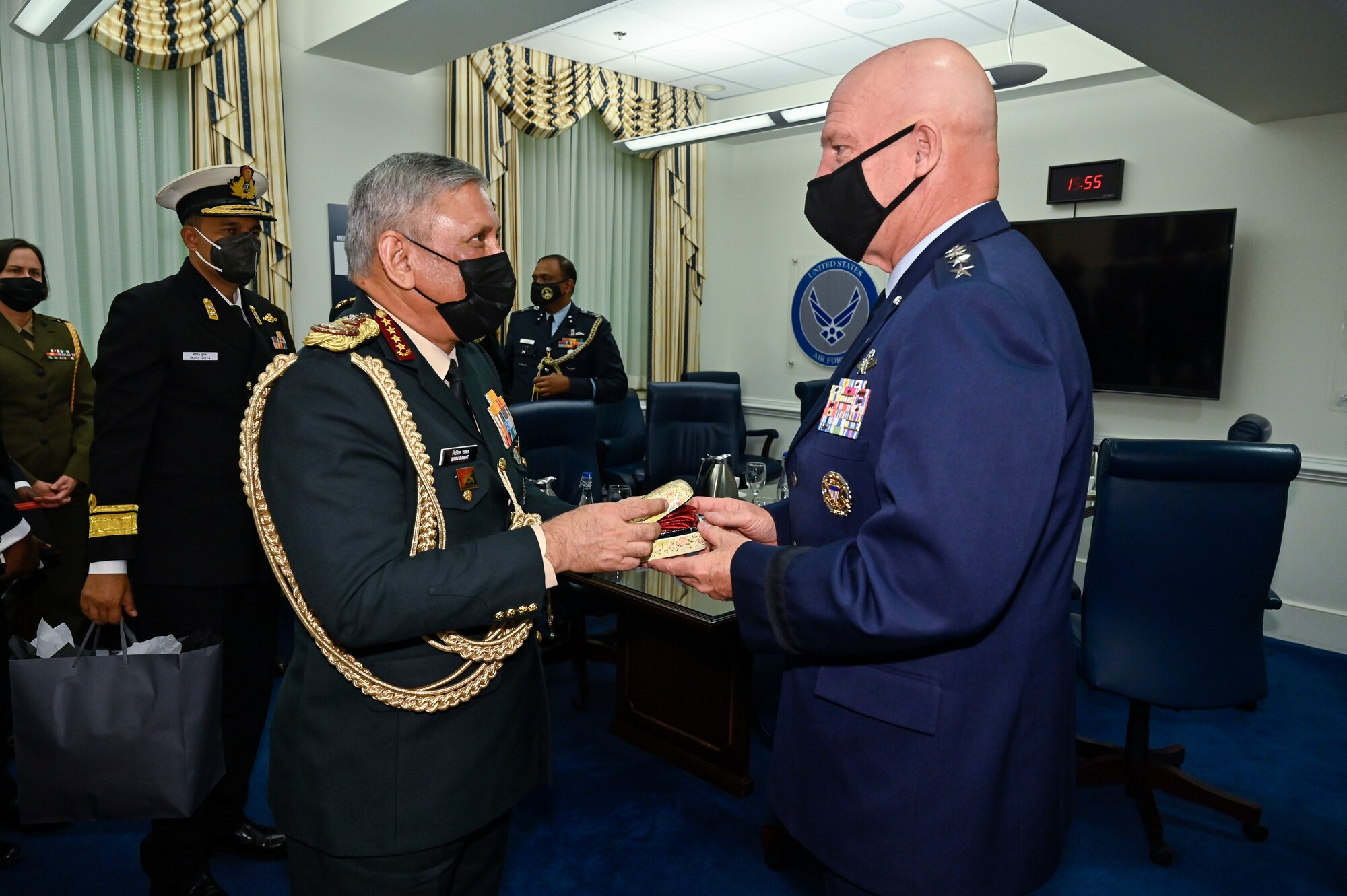 Gen. Bipin Rawat, chief of defence staff of India, presents a gift to Chief of Space Operations Gen. John W. “Jay” Raymond after a meeting