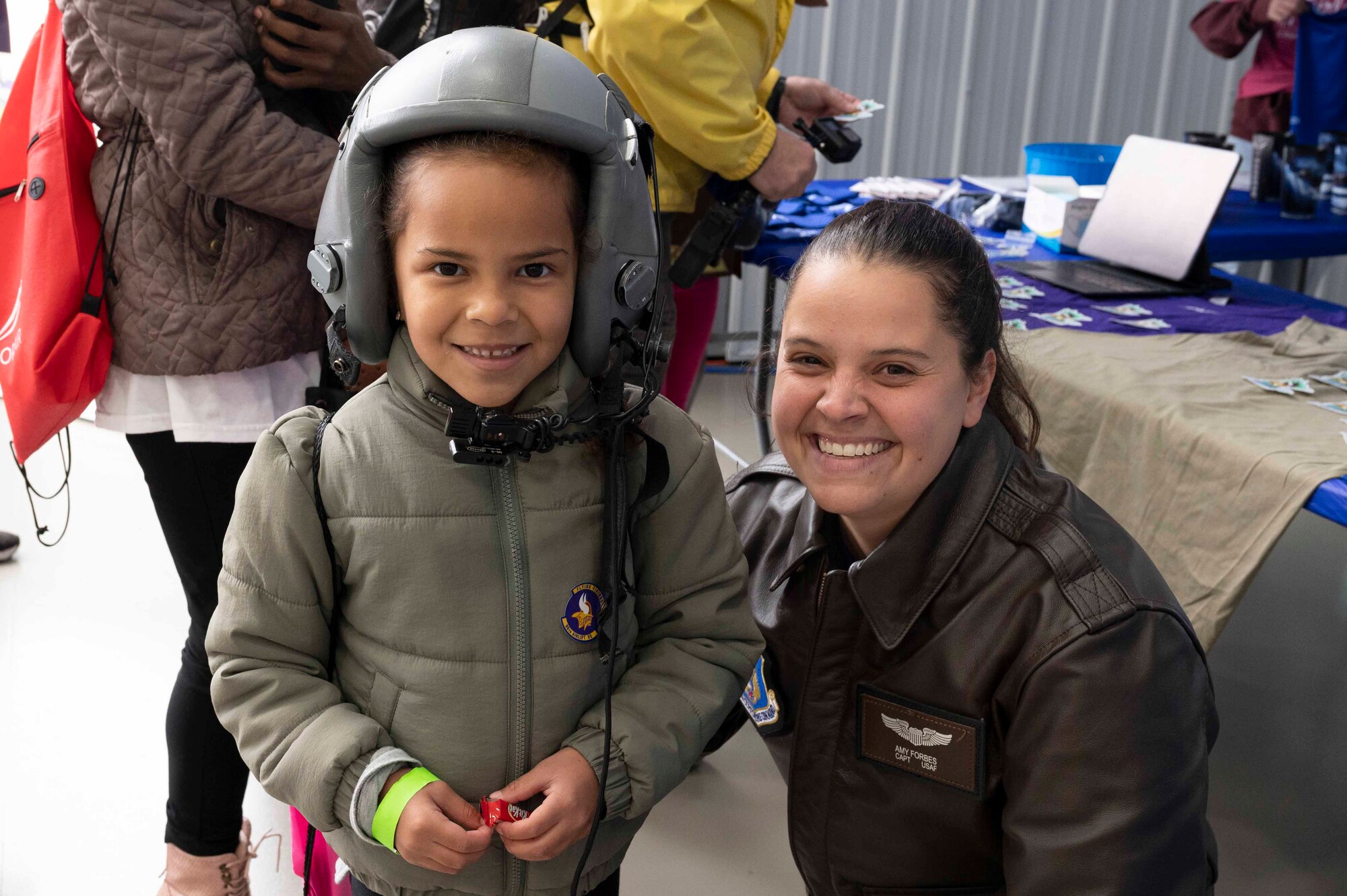 Capt. Amy Forbes, 96th Airlift Squadron pilot, poses with a young girl at the 7th annual Girls in Aviation Day hosted by the Women in Aviation International at the Flying Cloud Airport in Eden Prairie, Minn., on Sept. 25, 2021. After the 2020 event was cancelled due to the COVID-19 pandemic, participating in this year’s event was something the wing’s Reserve Citizen Airmen looked forward to.