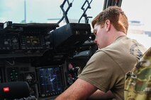 A U.S. Air Force pilot assigned to the 437th Airlift Wing prepares a C-17 Globemaster III for a flight to deliver cargo and troops to Afghanistan at Joint Base Charleston, S.C.
