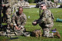 U.S. Army Soldiers assigned to the 82nd Airborne Division, Pope Army Airfield, N.C., prepare their gear to board a C-17 Globemaster III at Joint Base Charleston, S.C.