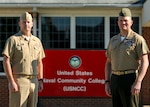 QUANTICO, Va. (Oct. 1, 2021) - Command Master Chief Tobi Howat, senior enlisted advisor to the U.S. Naval Community College, and Sergeant Major Mike Hensley, U.S. Marine Corps liaison for the USNCC, stand in front of the USNCC yard sign to celebrate the opening of applications for Pilot II of the USNCC. The USNCC is the community college of the Navy, Marine Corps, and Coast Guard and provides an opportunity for active duty enlisted Sailors, Marines and Coast Guardsmen to earn a naval-relevant associate degree through asynchronous online courses taught by military-friendly and experienced educators. (U.S. Navy photo by Chief Mass Communication Specialist Xander Gamble)