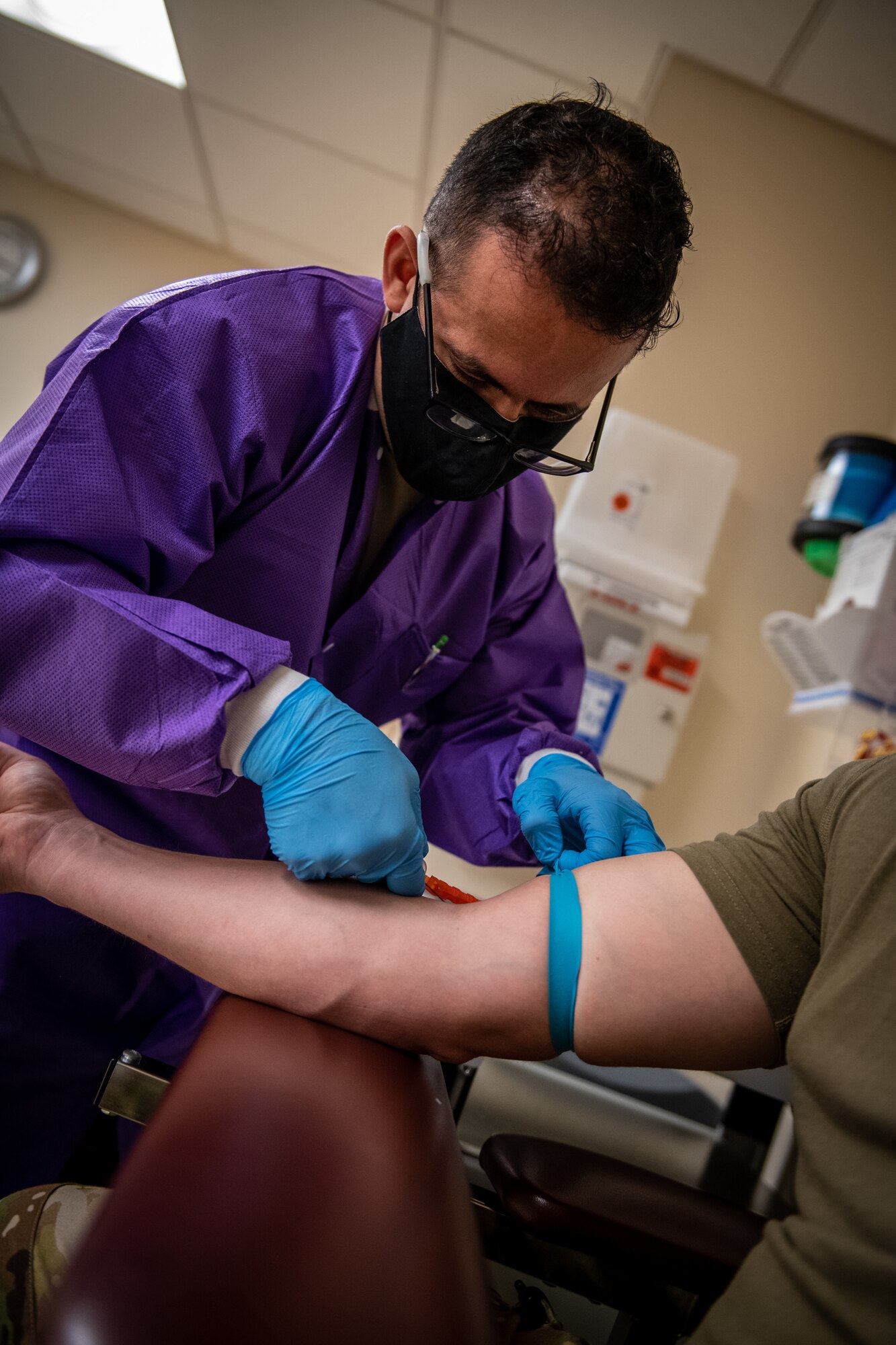 Senior Airman Issac Lenero Sanchez. 932nd Medical Group 4N0, medical technician, performs a blood draw during the September unit training assembly, Scott Air Force Base, Illinois, Sept. 11, 2021. To stay current and ready for possible deployments, Airmen must continually maintain currency of lab work and immunizations. (U.S. Air Force photo by Master Sgt. Christopher Parr)