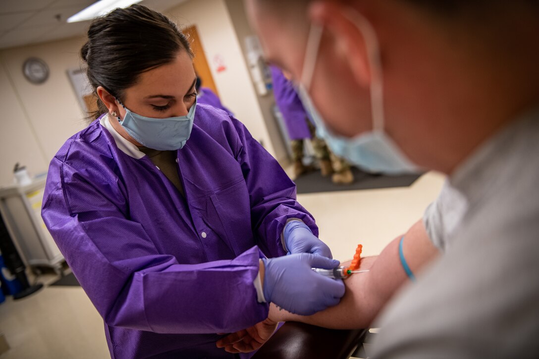 Staff Sgt. Emilee Garrison, 932nd Medical Group 4N0, medical technician performs a blood draw during the September unit training assembly, Scott Air Force Base, Illinois, Sept. 11, 2021. To stay current and ready for possible deployments, Airmen must continually maintain currency of lab work and immunizations.