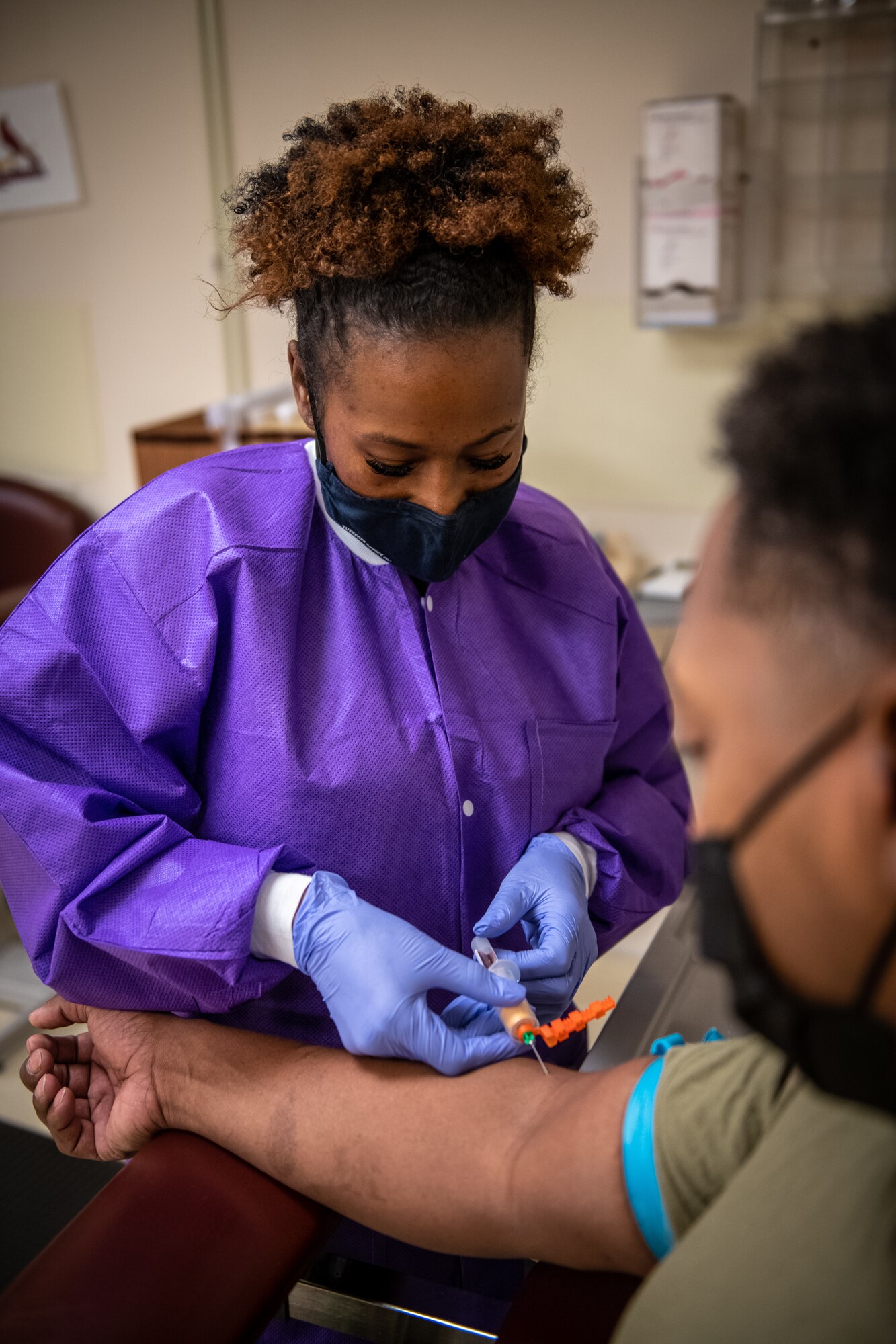 Senior Airman Shala Alred, 932nd Medical Group 4N0, medical technician performs a blood draw during the September unit training assembly, Scott Air Force Base, Illinois, Sept. 11, 2021. To stay current and ready for possible deployments, Airmen must continually maintain currency of lab work and immunizations.