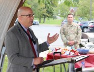 Chris Roan, left, speaks during his retirement ceremony Sept. 17 at Fort Detrick, Maryland. Looking on is Maj. Zachary Patterson. Roan retires with nearly 40 years of federal service.