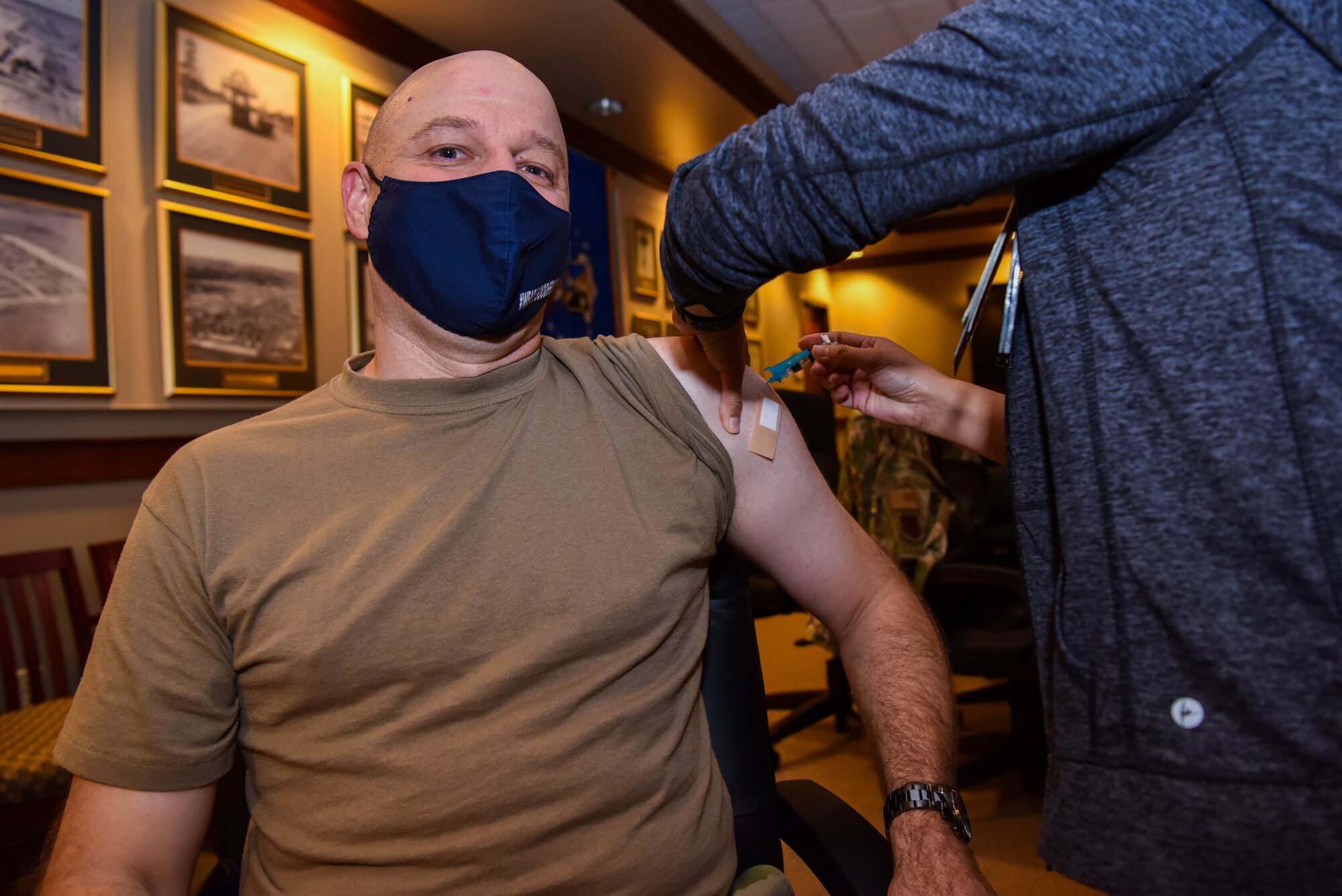 U.S. Air Force Col. Matthew Reilman, 17th Training Wing commander, receives his flu vaccination on Goodfellow Air Force Base, Texas, Oct. 1, 2021. Reilman was the first to be vaccinated at the Norma Brown Building. (U.S. Air Force photo by Senior Airman Jermaine Ayers)