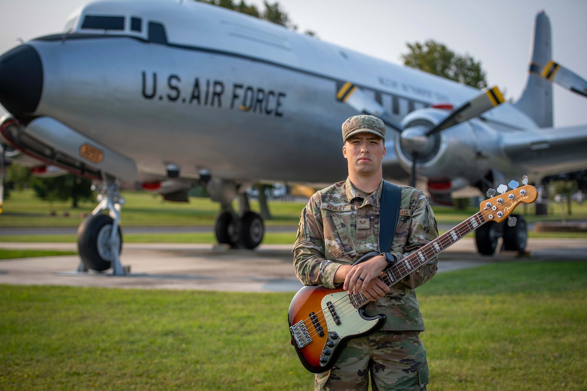 Staff Sgt. Zachary Kehley, 35th Aerial Port Squadron training manager, with the 514th Air Mobility Wing, poses for a photo in front of a static display at Joint Base McGuire-Dix-Lakehurst, N.J., September 12, 2021. Kehley and his band Poeta, are scheduled to perform at Rocktoberfeast October 1, 2021.