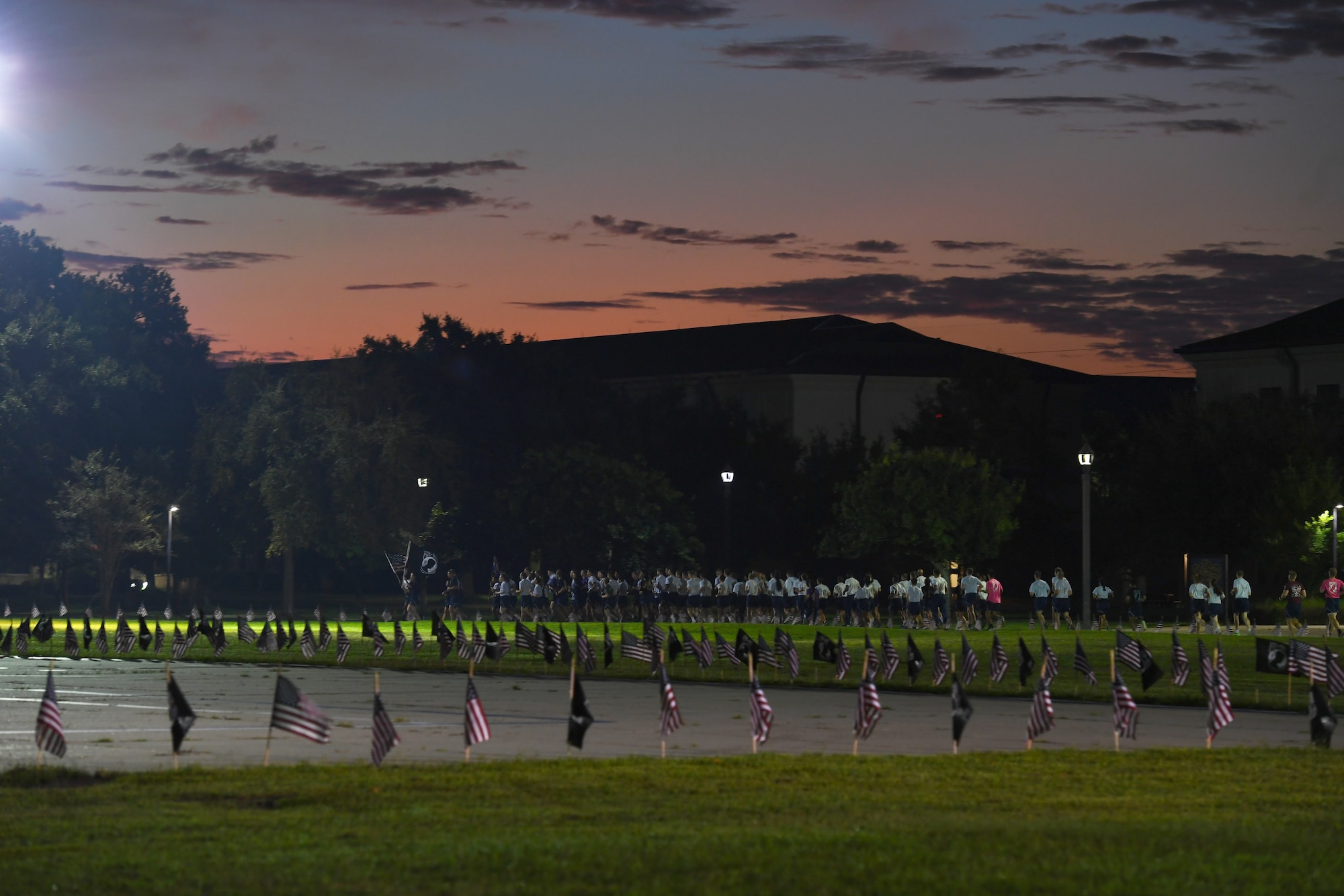 Keesler personnel participate in the POW/MIA run and vigil at Keesler Air Force Base, Mississippi, Oct. 1, 2021. This event, hosted by the Air Force Sergeants Association Chapter 652, is held annually to raise awareness and pay tribute to all prisoners of war and the military members still missing in action. (U.S. Air Force photo by Kemberly Groue)