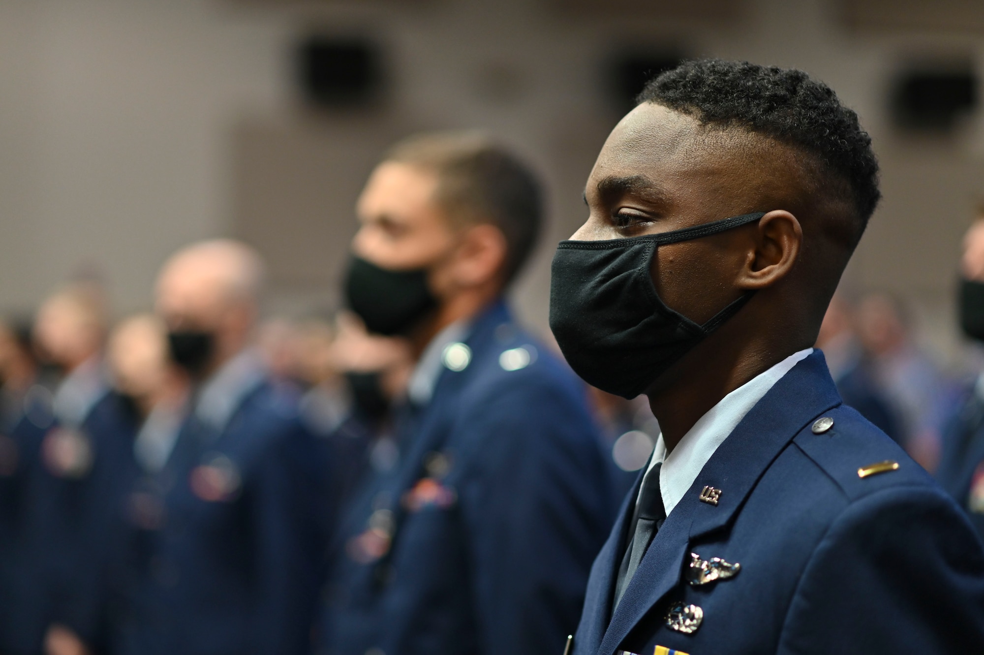 U.S. Air Force 2nd Lt. Alexandre Jeremie, Specialized Undergraduate Pilot Training graduate, stands at attention at his graduation ceremony, Oct. 1, 2021, on Columbus Air Force Base, Miss. Jeremie is assigned to the 105th Airlift Wing, Stewart Air National Guard Base, New York, where he will begin training on the C-17. (U.S Air Force photo by Airman 1st Class Jessica Haynie)