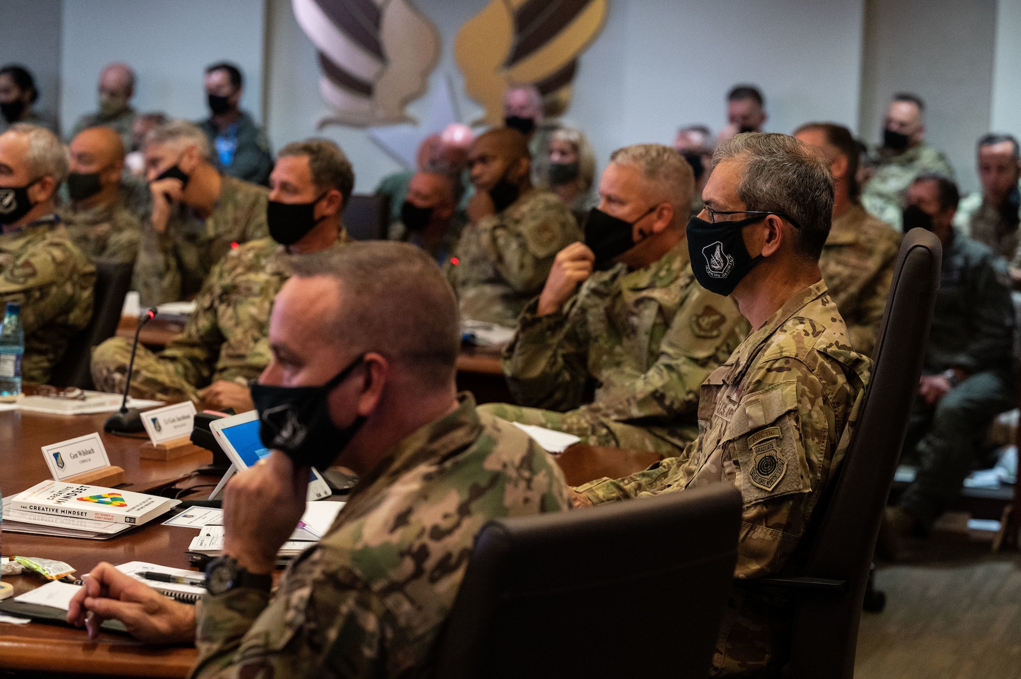 U.S. Air Force Gen. Ken Wilsbach, right, Pacific Air Forces commander, discuss Action Order B items with PACAF staff, Wing and Numbered Air Force commanders and command chiefs during the PACAF Fall Commander’s Conference at Joint Base Pearl Harbor-Hickam, Hawaii, Sept. 28, 2021. Wing and NAF commanders were able to submit proposed changes to Wilsbach for approval to cut out bureaucratic layers within their organizations to become more mission ready and capable. (U.S. Air Force photo by Staff Sgt. Hailey Haux)