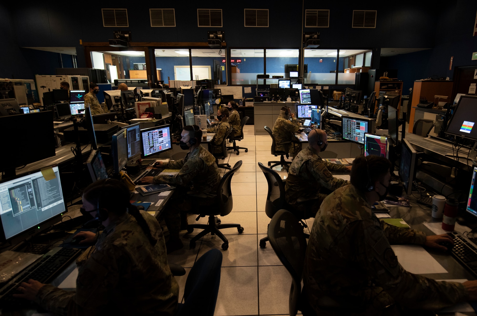 Hawaii and Oregon Air National Guard Airmen monitor pods of computer screens displaying the airspace above the Hawaiian islands during exercise Sentry Aloha 2021, Aug. 24, 2021. Hawaii Air National Guard air defense experts teamed with the Oregon Air National Guard’s 116th Air Control Squadron to control F-22 Raptors and F-15 Eagles participating in Sentry Aloha 2021.