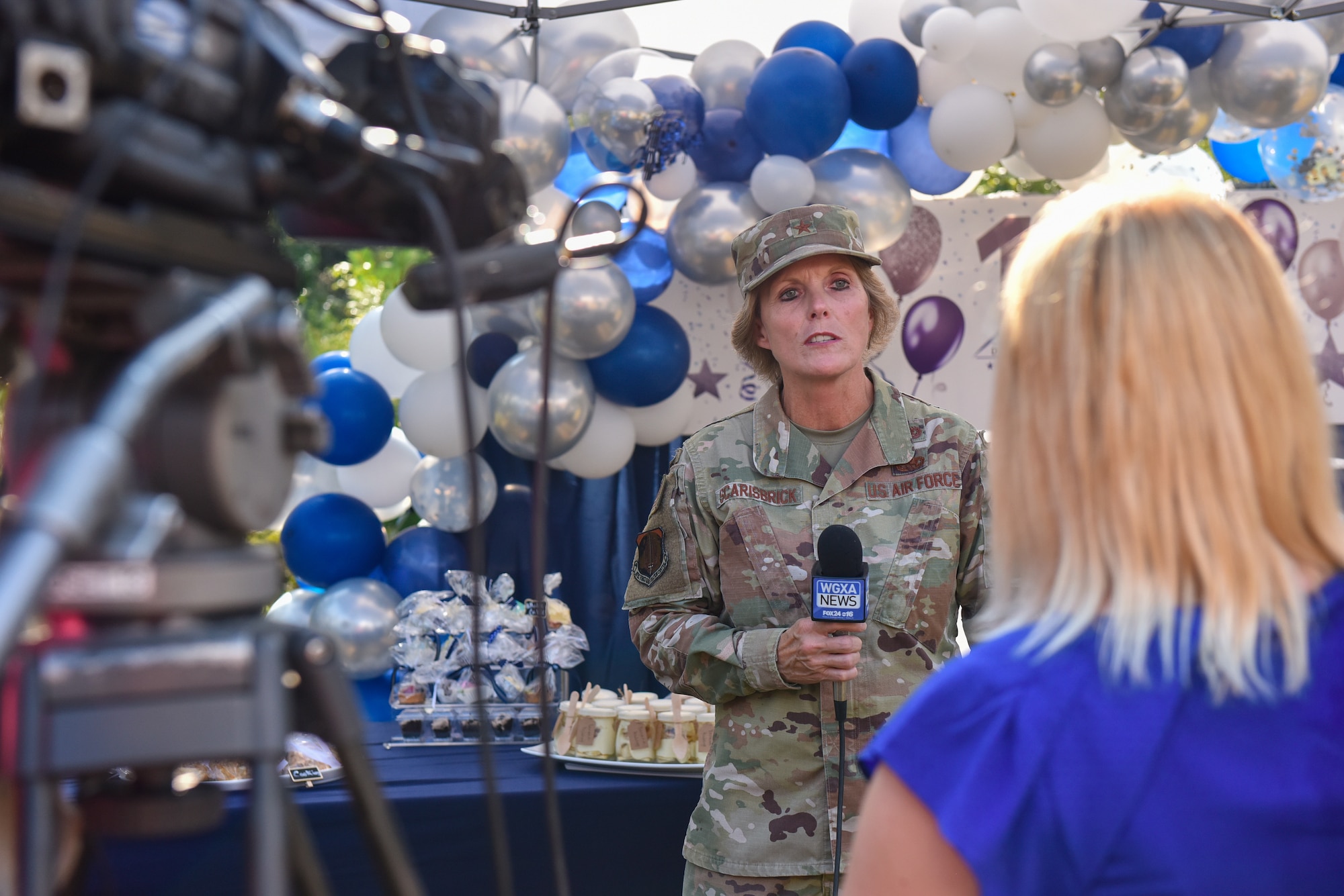 Brig. Gen. Stacey L. Scarisbrick, commander of Air Force Reserve Command's Force Generation Center, gives a media interview immediately following a ceremony celebrating the 10th anniversary of the FGC at Robins Air Force Base, Georgia, Oct. 1, 2021. The FGC is the single organization responsible for generating Air Force Reserve forces by leveraging Reserve strategic capability to meet operational needs in support of the global force. The Reserve Citizen Airmen who support the FGC perform all aspects of force generation to include oversight, visibility and accountability of more than 70,000 Air Force Reserve forces. (U.S. Air Force photo by Misuzu Allen)