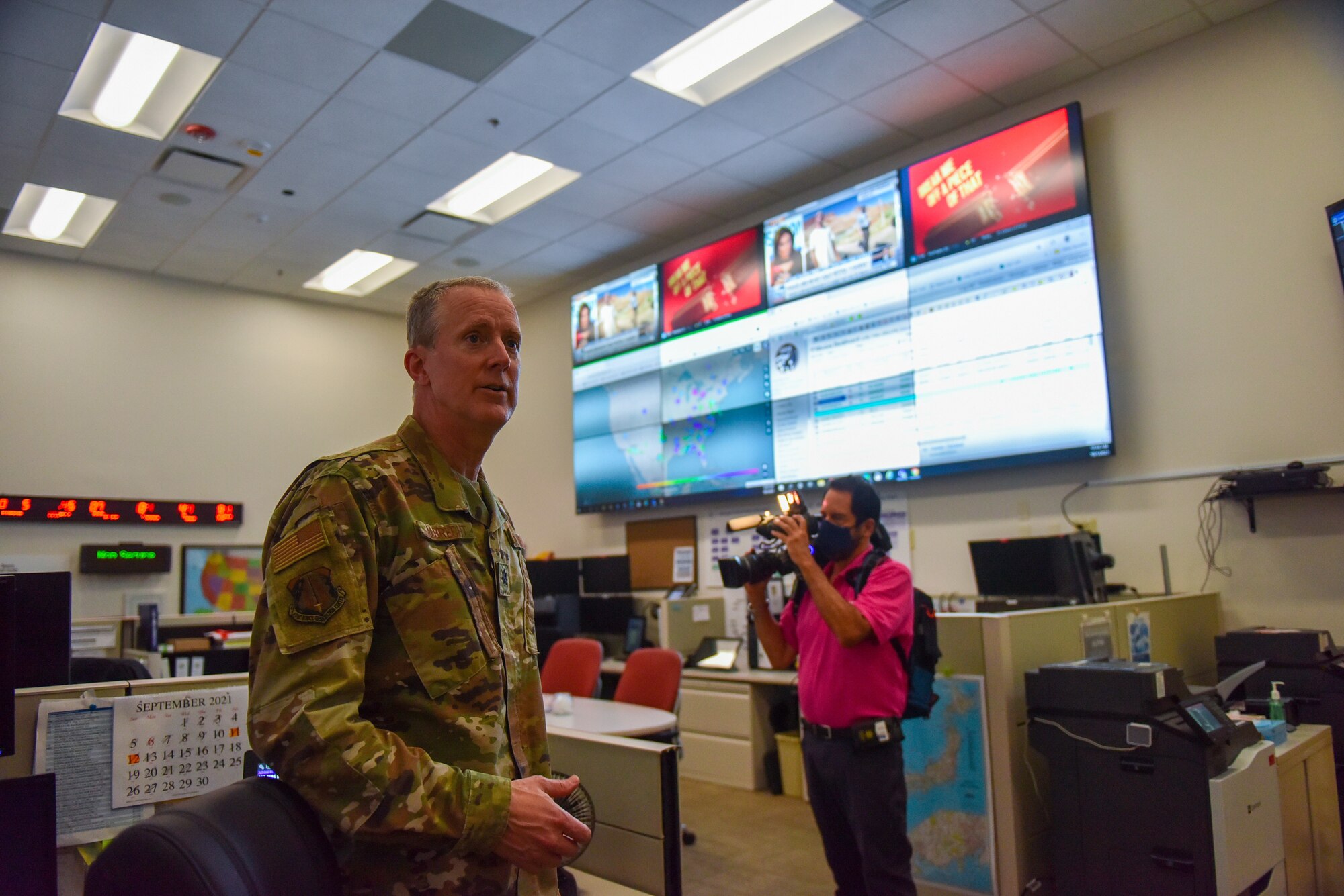 Lt. Col. Thomas Albrecht, chief of the Air Force Reserve Command's Force Generation battle watch, gives media a tour of the FGC battle watch station after a ceremony celebrating the 10th anniversary of AFRC's FGC at Robins Air Force Base, Georgia, Oct. 1, 2021. The battle watch is a command and control center that operates 24/7 to provide support to Air Force Reserve missions around the world. The FGC is the single organization responsible for generating Air Force Reserve forces by leveraging Reserve strategic capability to meet operational needs in support of the global force. The Reserve Citizen Airmen who support the FGC perform all aspects of force generation to include oversight, visibility and accountability of more than 70,000 Air Force Reserve forces. (U.S. Air Force photo by Misuzu Allen)