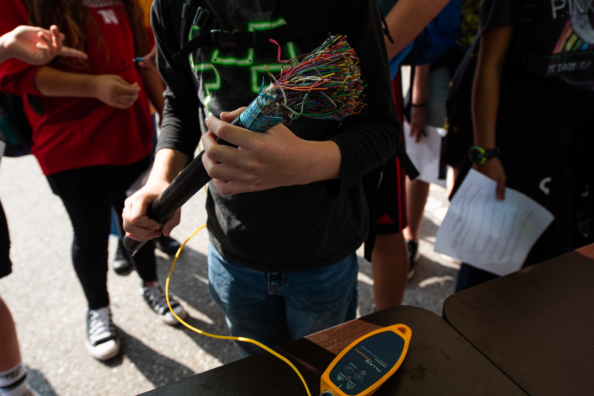 Attendees of an open house event hosted by the 51st Communications Squadron examine a cable at Osan Air Base, Republic of Korea, Oct. 1, 2021.