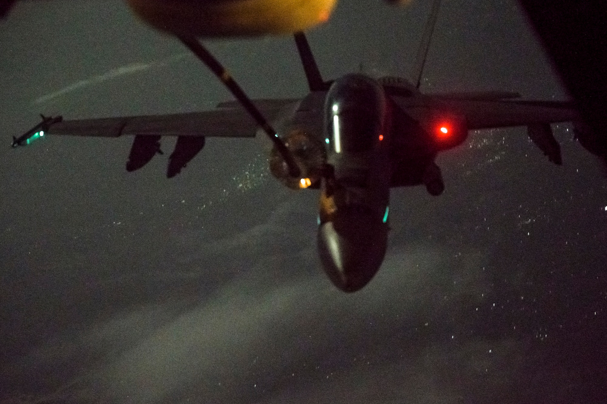 F/A-18 Hornet aircraft approaches a KC-10 Extender aircraft over Afghanistan to receive fuel
