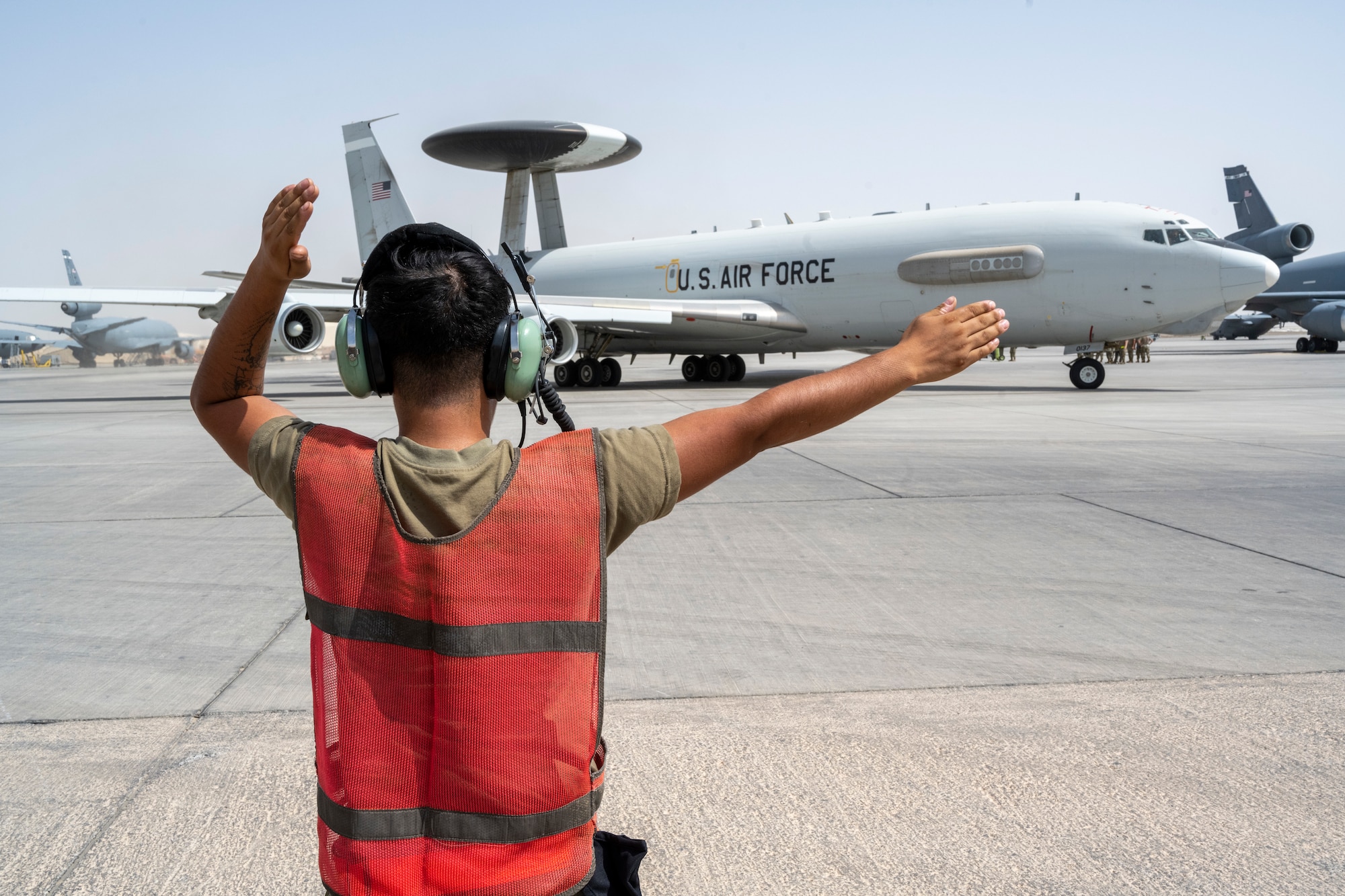 Airman directs E-3 taxiing